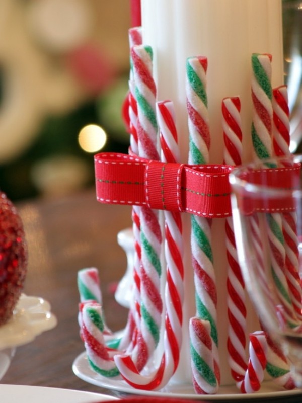 A dish of candy canes tied with a ribbon