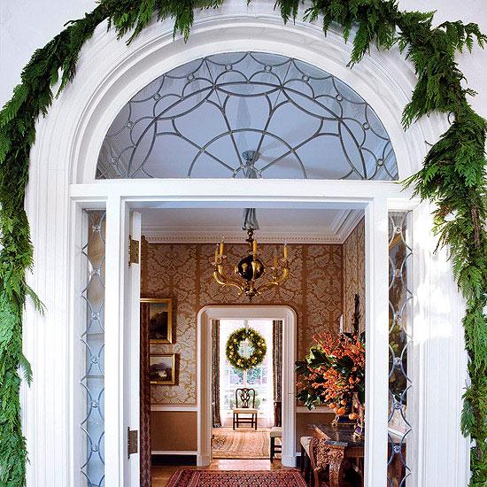Christmas front door decoration arch of green garland