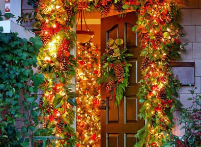 Christmas-front-door-decoration-garlands-of-lights-and-greenery-red-ribbons