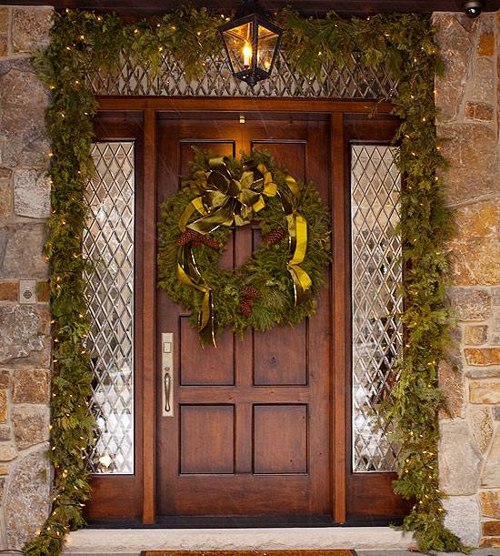 Christmas front door decoration green fir garland with lights and matching wreath