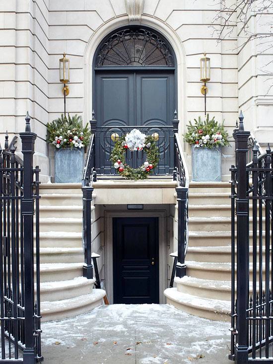 Christmas front door decoration symmetry pots of greenery central wreath