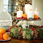 Christmas-table-wreath-centerpiece-cranberries-candles-clementines