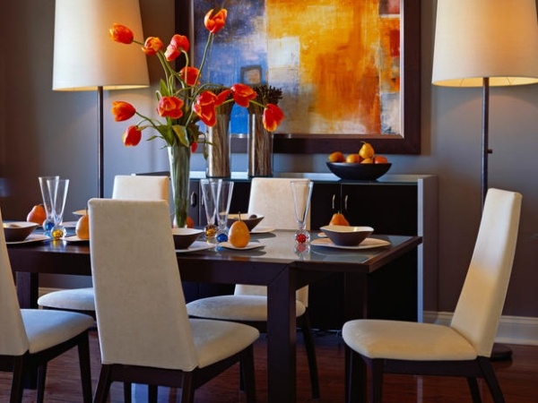 dark dining room decor and orange wall art contrast