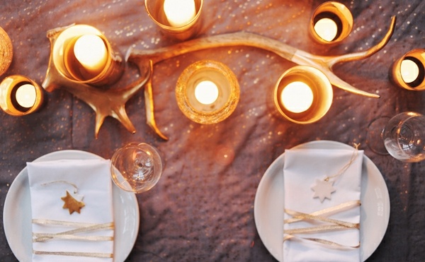 Festive table decoration wreaths rustic candles and gold