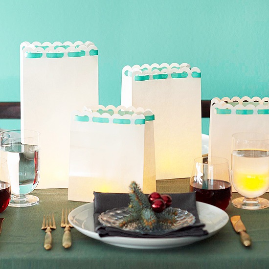 Rimmed paper bags with candles inside christmas table ideas