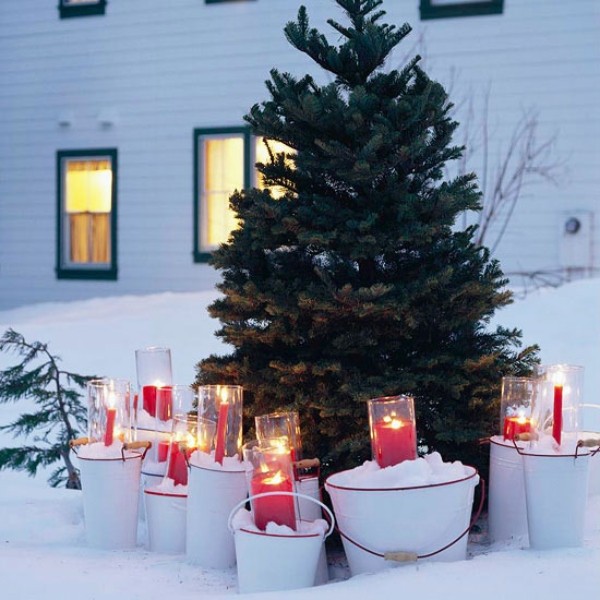 candle filled buckets and christmas tree