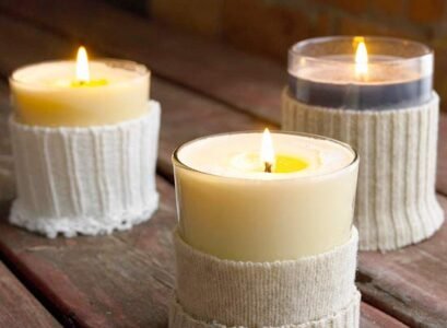 candles-in-cutted-sweater-sleeve