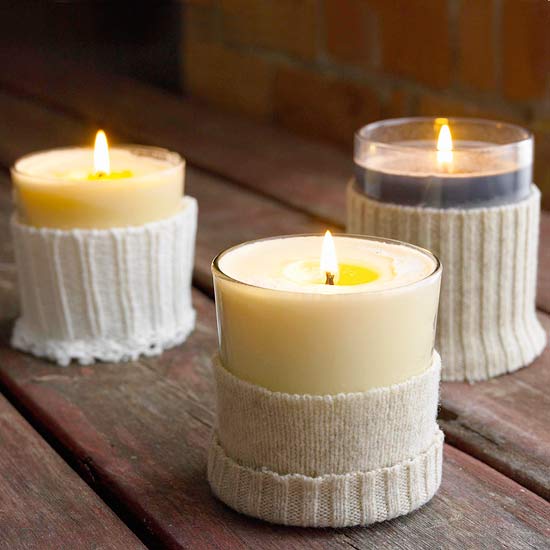 candles in cutted sweater sleeve