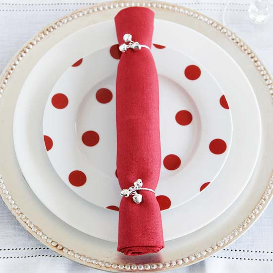 christmas coloured napkin and bell rings