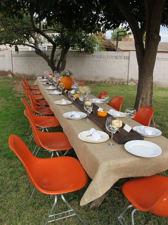 outdoor thanksgiving dinner party decorating ideas orange chairs accents
