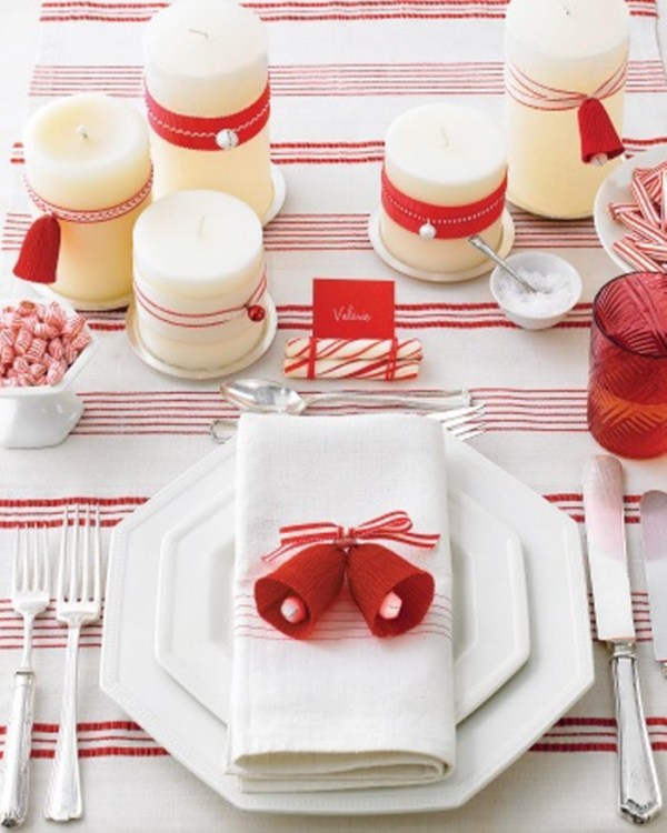 Christmas decoration table with accented candles and napkins