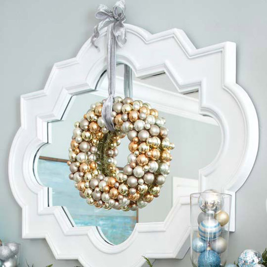 silver Christmas ornaments silver wreath in front mirror