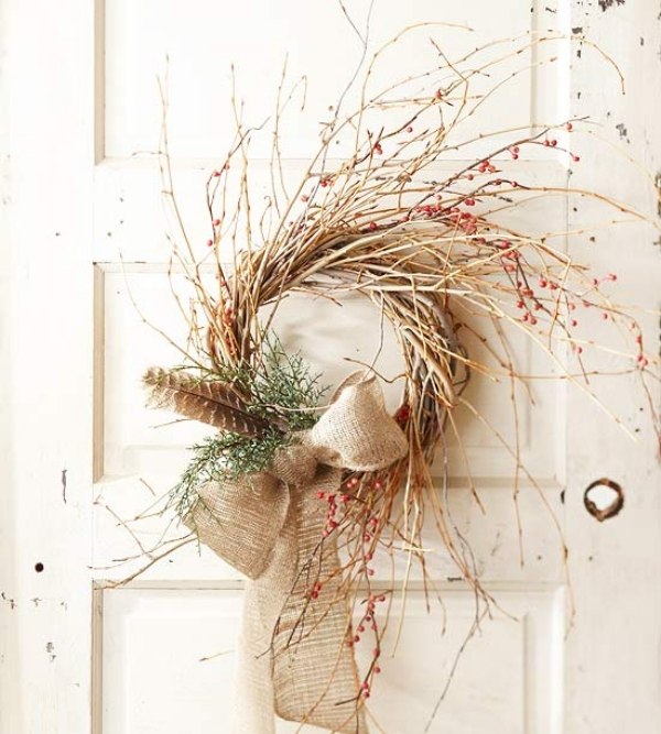 simple christmas wreath made of bare branches and ribbon