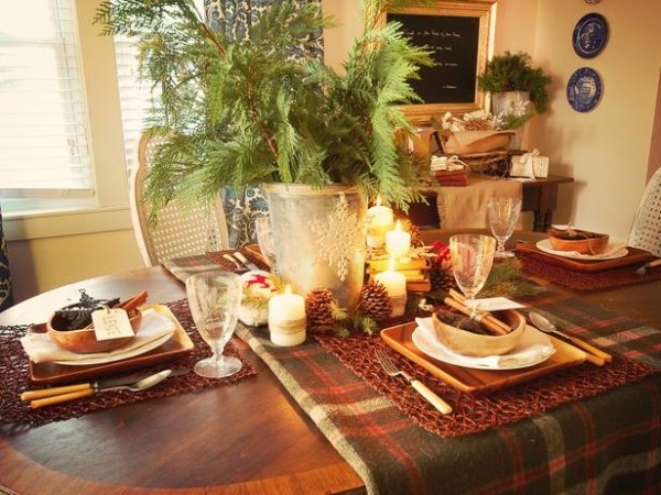 stylish table setting evergreens centerpiece