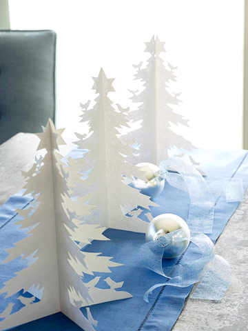 white paper christmas trees blue table runner and ornament