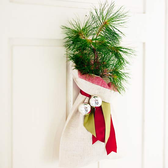 decorating front door accent branches jingle bells