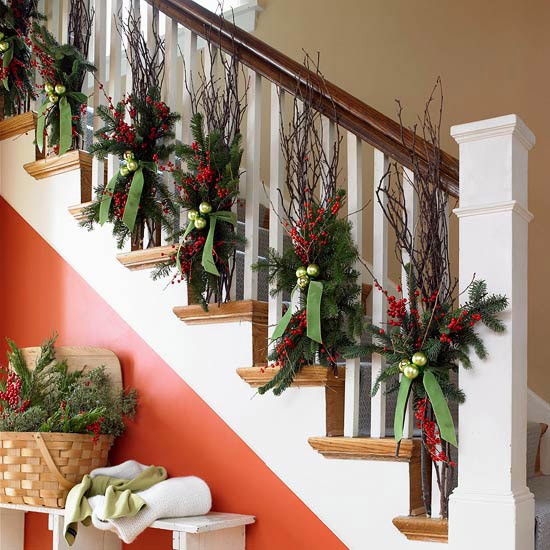 stylish holiday decor bare tree winterberry branches staircase