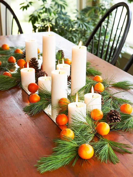 holiday decorating ideas table centerpiece evergreens candles fruits