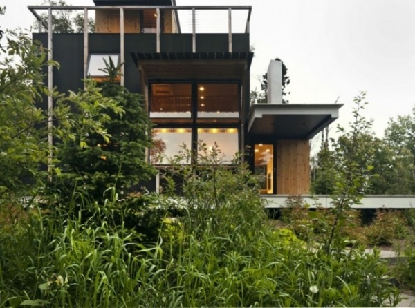 Modern mountain cliff house cabin floor to ceiling windows