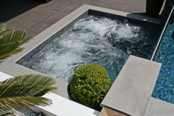 Oxted England exterior swimming pool waterfall basin