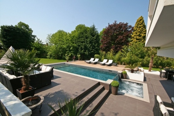 beautiful swimming pool waterfall feature Oxted England