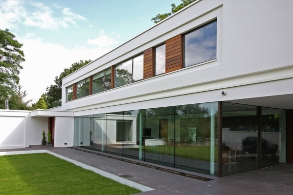 modern house architecture floor to ceiling glass walls Oxted England