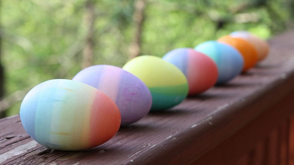 Easter decoration ideas porch railing display of colored eggs