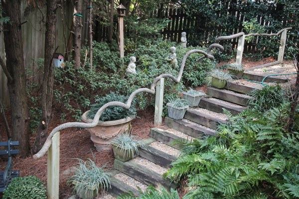 Garden design ideas wooden stair railing flower pots 