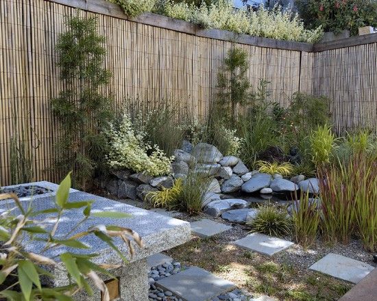 Japanese style garden privacy bamboo fence plants stone concrete garden table