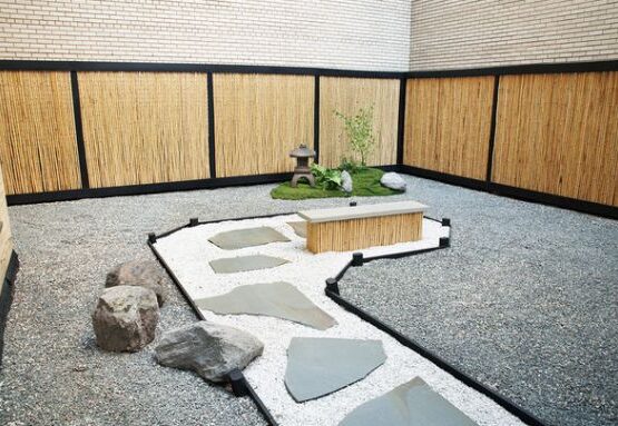 Stylish-Japanese-garden-assymetric-stones-path-gravel-bamboo-fence-panels