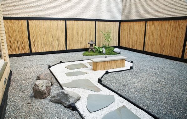 Stylish Japanese garden assymetric stone path bamboo fence panels