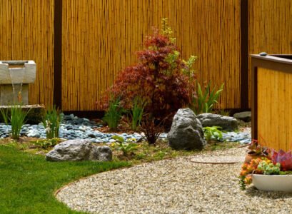 bamboo-garden-fence-Japanese-style-landscape-plants-lawn-pebble-path-high-vertical-fence