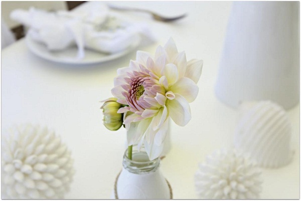chic stylish table setting dahlia in white bottle