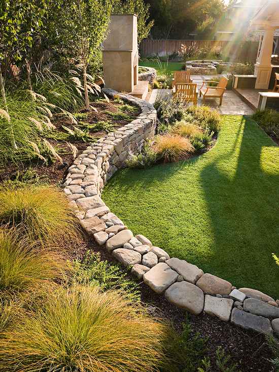 curved stone wall in traditional landscape design
