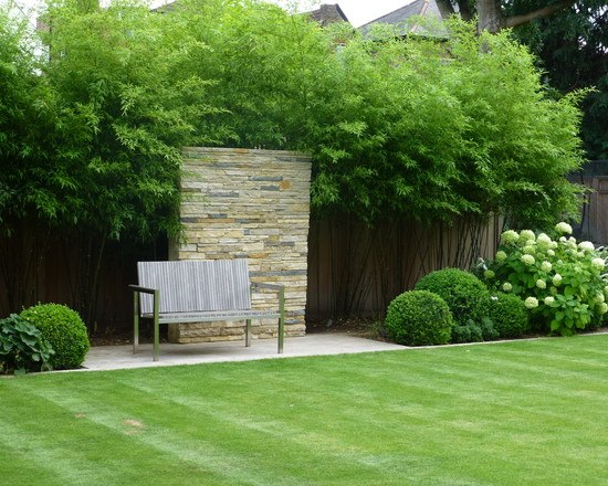 modern garden design ideas sone wall bamboo fence panels bench
