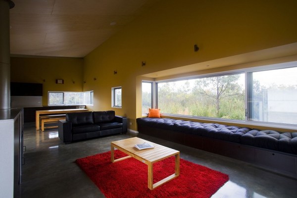 modern home interior large living area bright yellow walls