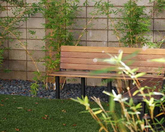 small garden with bamboo trees wooden bench