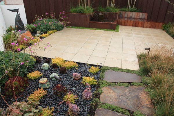 small patio design stone path tiles succulents pebbles