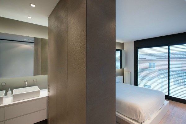 stylish elegant bedroom white bed bathroom vanity mirror Cervantes House