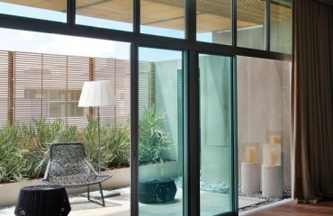 Balcony-furniture-chair-table-glass-window-bedroom Casa-Cor