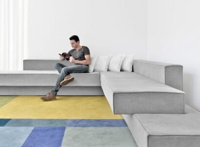 Cantilevered-sofa-by-Paulo-Kobylka-modern-living-room-furniture-grey-upholstery