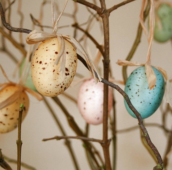 Easter home decor blown out speckled eggs on tree branch