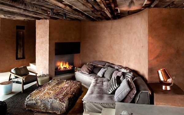 interior fireplace cushion sofa orange wall colors natural materials