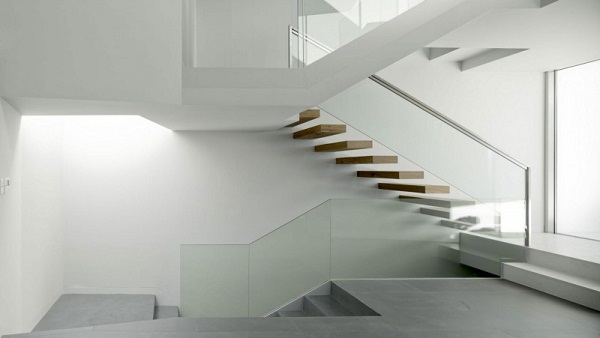 Minimalist cantilever wooden staircase interior 