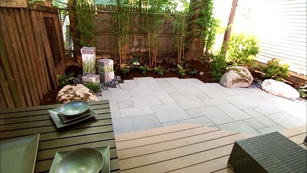 Patio design ideas bamboo plants decorative fence panels stone flooring