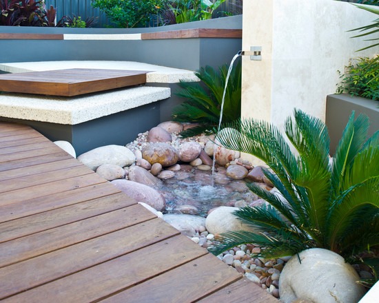 Water fountain small stones palm tree patio flooring
