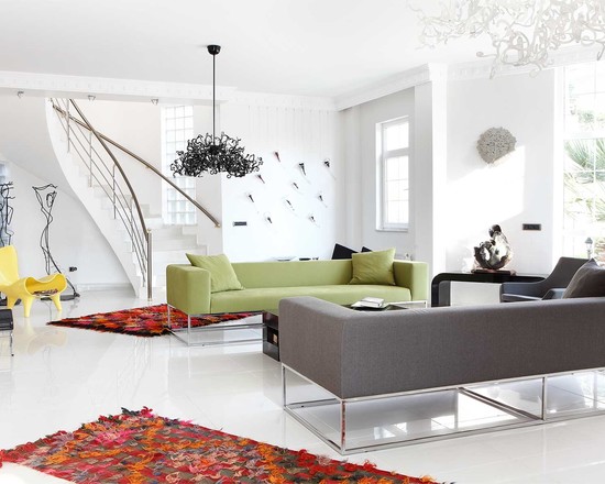  green gray sofas white wall chandelier