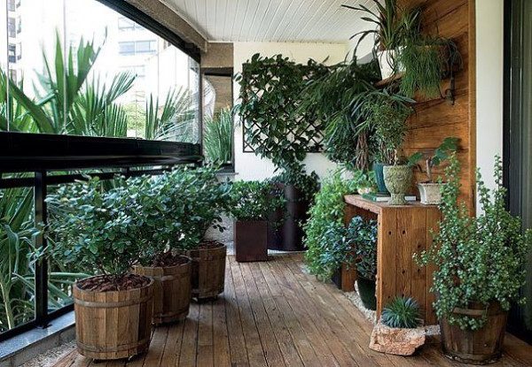 wooden deck big wooden plant containers gravel
