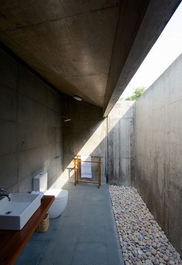 bathroom outdoor use pebbles concrete walls glass ceiling column