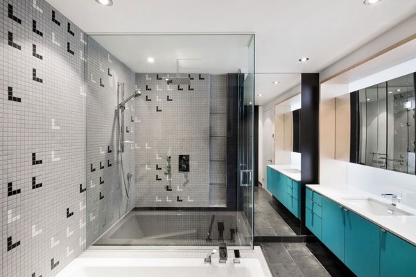 bathroom walk in shower glass wall mosaic wall tiles blue sink vanity